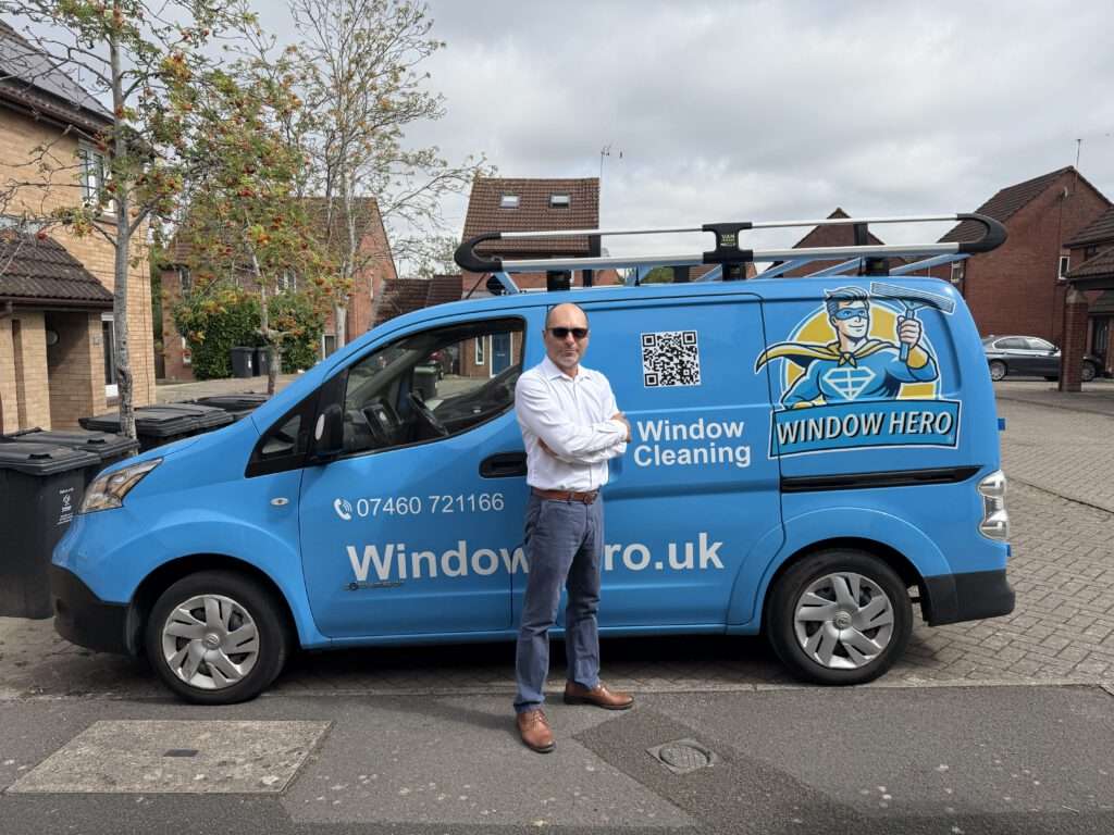 Hassan standing next to Window Hero van